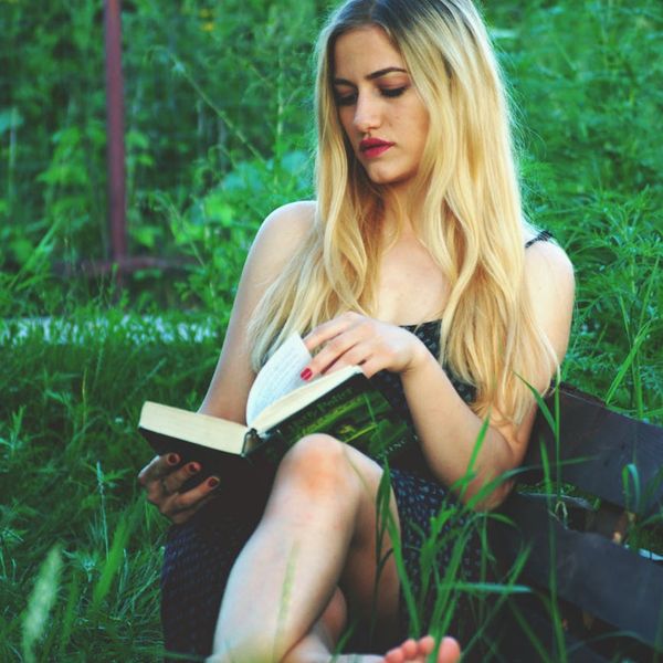 Person enjoying a moment of peace and wellness outdoors.
